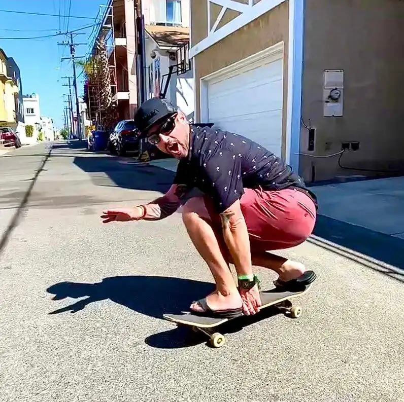 Josh Muzzy on a skateboard