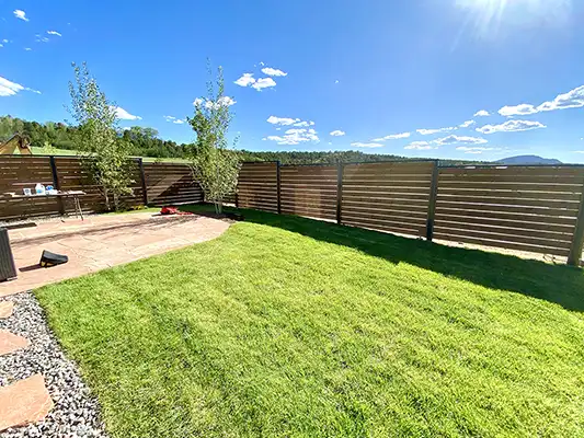 modern wooden fence near Durango bordering a lawn